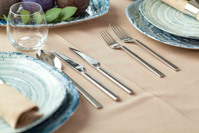 Table setting set with candles and plant branches